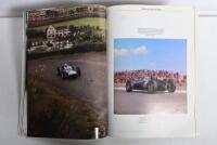 GRAND PRIX: 'THE GRAND PRIX DRIVERS' softcover book. Book signed by 10 World Champions and 5 Grand Prix winners. Signatures include Juan Manuel Fangio, Denis Hulme, Alan Jones, Rene Arnoux, Stirling Moss & Patrick Tambay. Superb signature set - 18