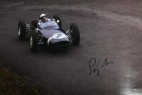 GRAND PRIX: 'THE GRAND PRIX DRIVERS' softcover book. Book signed by 10 World Champions and 5 Grand Prix winners. Signatures include Juan Manuel Fangio, Denis Hulme, Alan Jones, Rene Arnoux, Stirling Moss & Patrick Tambay. Superb signature set - 19