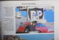 GRAND PRIX: 'THE GRAND PRIX DRIVERS' softcover book. Book signed by 10 World Champions and 5 Grand Prix winners. Signatures include Juan Manuel Fangio, Denis Hulme, Alan Jones, Rene Arnoux, Stirling Moss & Patrick Tambay. Superb signature set - 21