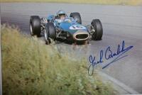 GRAND PRIX: 'THE GRAND PRIX DRIVERS' softcover book. Book signed by 10 World Champions and 5 Grand Prix winners. Signatures include Juan Manuel Fangio, Denis Hulme, Alan Jones, Rene Arnoux, Stirling Moss & Patrick Tambay. Superb signature set - 22