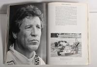 GRAND PRIX: 'THE GRAND PRIX DRIVERS' softcover book. Book signed by 10 World Champions and 5 Grand Prix winners. Signatures include Juan Manuel Fangio, Denis Hulme, Alan Jones, Rene Arnoux, Stirling Moss & Patrick Tambay. Superb signature set - 27