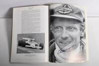 GRAND PRIX: 'THE GRAND PRIX DRIVERS' softcover book. Book signed by 10 World Champions and 5 Grand Prix winners. Signatures include Juan Manuel Fangio, Denis Hulme, Alan Jones, Rene Arnoux, Stirling Moss & Patrick Tambay. Superb signature set - 35