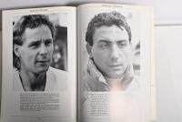 GRAND PRIX: 'THE GRAND PRIX DRIVERS' softcover book. Book signed by 10 World Champions and 5 Grand Prix winners. Signatures include Juan Manuel Fangio, Denis Hulme, Alan Jones, Rene Arnoux, Stirling Moss & Patrick Tambay. Superb signature set - 37