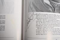 GRAND PRIX: 'THE GRAND PRIX DRIVERS' softcover book. Book signed by 10 World Champions and 5 Grand Prix winners. Signatures include Juan Manuel Fangio, Denis Hulme, Alan Jones, Rene Arnoux, Stirling Moss & Patrick Tambay. Superb signature set - 38