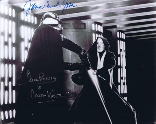 STAR WARS: A black and white picture of Darth Vader battling Obi-Wan Kenobi, Autographed by James Earl Jones, Dave Prowse, and Alec Guinness.
