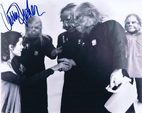 STAR WARS: A black and white picture depicting Princess Leia in a scene, autographed by Carrie Fisher