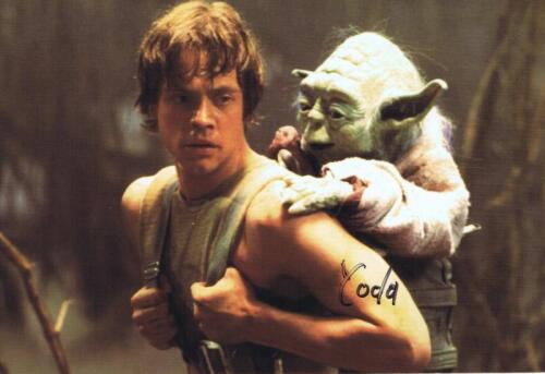 STAR WARS: A colour The Empire Strikes Back post card depicting Luke Skywalker and Yoda both sides autographed by Frank Oz