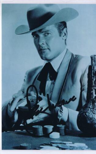 MAVERICK: A black and white laminated picture of Beau Maverick, autographed by Roger Moore