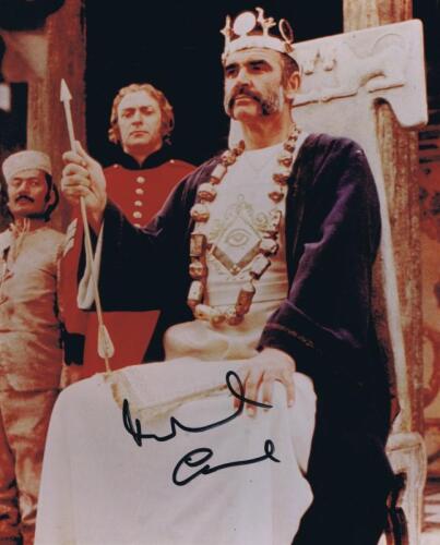 MICHAEL CAINE: A colour picture depicting Michael Caine, Sean Connery, Saeed Jaffrey from 'The Man Who Would Be King" autographed by Michael Caine