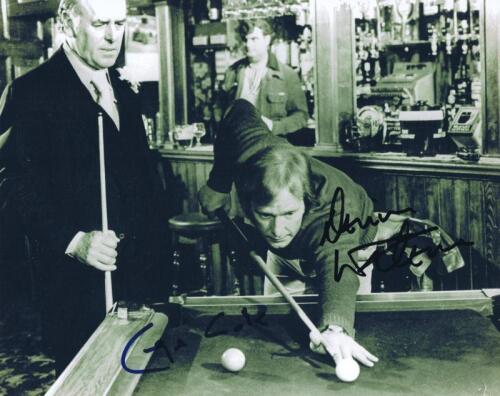 MINDER: A black and white picture depicting George Cole and Dennis Waterman playing pool, autographed by George Cole in blue marker and Dennis Waterman in black marker