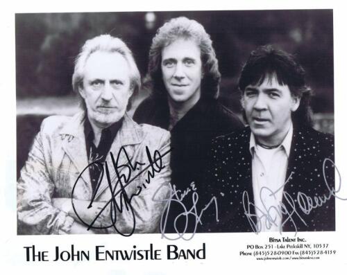 JOHN ENTWISTLE BAND: A black and white "THE JOHN ENTWISTLE BAND" picture card. Card signed by all band members - John Entwistle, Steve Luongo, Godfrey Townsend