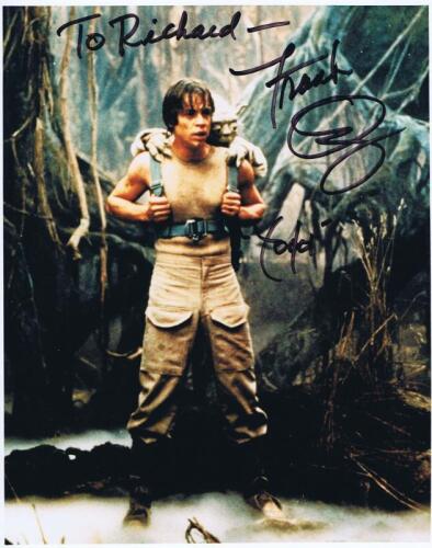 STAR WARS: A colour picture depicting Yoda on the back of Luke, personally signed and inscribed by Frank Oz