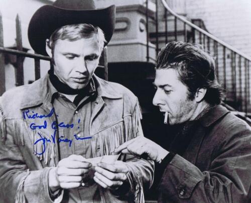 MIDNIGHT COWBOY: A black and white picture from 'Midnight Cowboy' featuring Jon Voight and Dustin Hoffman, autographed by Jon Voight