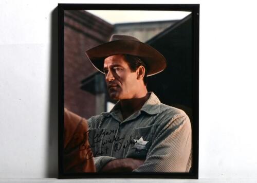 CLINT WALKER: A colour portrait of Clint Walker from film Yuma, personally inscribed and signed by Clint Walker, framed and glazed