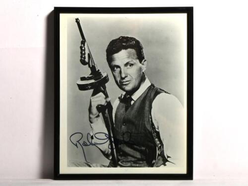 ROBERT STACK: A black and white picture of Robert Stack from film the 'Untouchables', autographed by Robert Stack in black marker.