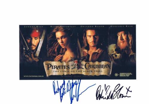 PIRATES OF THE CARIBBEAN: A colour picture of film 'Pirates of the Caribbean The Curse of the Black Pearl' autographed by Orlando Bloom and personally inscribed and signed by Geoffery Rush.&nbsp;