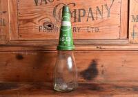 CASTROL: A 1940/50s "Castrol" embossed one imperial pint oil bottle, with late 20th century "Castrol XXL 40-50 MS" tin pourer and dust cover