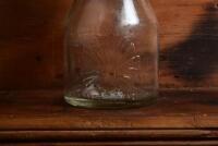 SHELL: A circa 1930s "Shell" embossed one imperial pint oil bottle, with circa 1950s "SHell 40 X-100" tin pourer and dust cover - 2