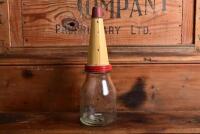 SHELL: A circa 1930s "Shell" embossed one imperial pint oil bottle, with circa 1950s "SHell 40 X-100" tin pourer and dust cover - 4