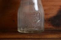 CASTROL: A 1940/50s "Castrol" embossed one imperial pint oil bottle, with late 1950/60s "Castrol AA SAE 40" tin pourer and dust cover - 2