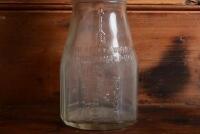 CASTROL: A 1940/50s "Castrol" embossed one imperial pint oil bottle, with late 1950/60s "Castrol AA SAE 40" tin pourer and dust cover - 5