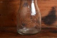ESSO: A mid 20th century "ESSO" embossed one imperial pint oil bottle, with "Esso Motor Oil 20W/30" tin pourer and dust cover - 2