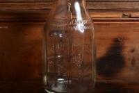 CASTROL: A 1940/50s "Castrol" embossed one imperial pint oil bottle, with 1950/60s "Castrol AA SAE 40" tin pourer and dust cover - 5