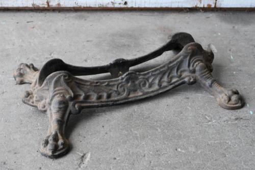 BICYCLE STAND: A decorative antique cast iron claw foot bicycle stand, 40cm long