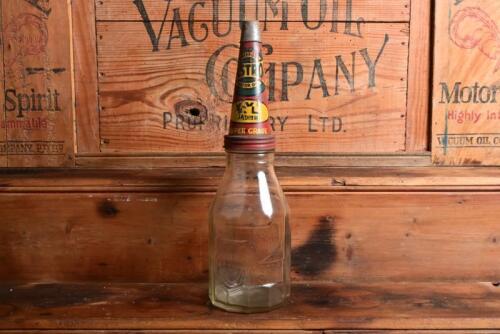 CASTROL: A 1940/50s "Castrol" embossed one imperial quart oil bottle, with circa 1900/1910 "Castrol XL Super Grade" tin pourer and dust cover
