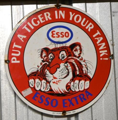 ESSO: An original enamelled "Esso, Put a Tiger in Your Tank" sign, printed lower centre: W.F. Vilas Limited, 1962, 30cm diameter