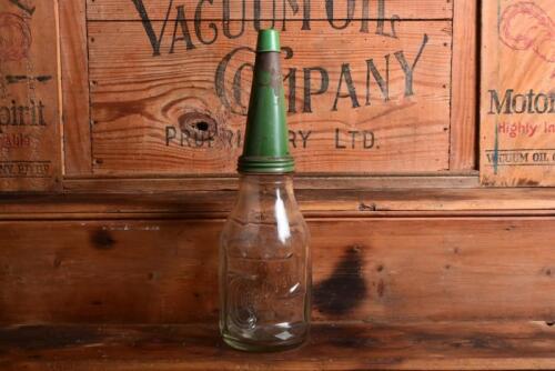 CASTROL: A 1940/50s "Castrol" embossed one imperial quart oil bottle, with green tin pourer and dust cover (updated description)