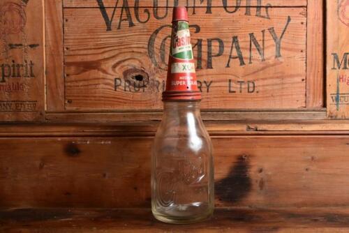 CASTROL: A 1940/50s "Castrol" embossed one imperial quart oil bottle, with circa 1950/1960s "Castrol XL Medium Super Grade" tin pourer and dust cover