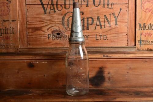 CALTEX: An early "Caltex" embossed one quart oil bottle, with later tin pourer and dust cover