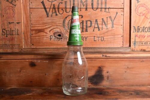CASTROL: A 1940/50s "Castrol" embossed one imperial quart oil bottle, with 1950/60s "Castrol CW 30-40 MS" tin pourer and dust cover