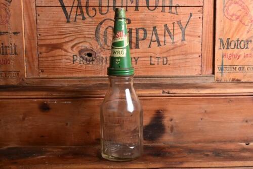 CASTROL: A 1940/50s "Castrol" embossed one imperial quart oil bottle, with 1950/60s "Castrol WRG SAE 50?" tin pourer and dust cover (updated description)
