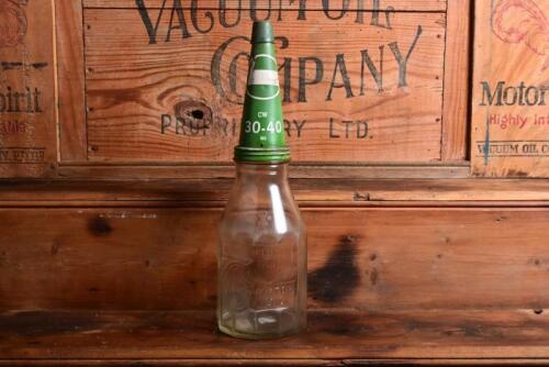 CASTROL: A 1940/50s "Castrol" embossed one imperial quart oil bottle, with late 20th century "Castrol CW 30-40 MS" tin pourer and dust cover