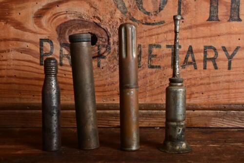 OILERS: Two oilers made from shotgun cartridges and two dippers, the longest 11cm