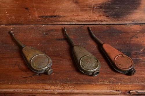 THE KEYSTONE: An Australian circa 1900 "Rega" thumb oiler and two circa 1900 "The Keystone" nickel on brass oilers, longest 13.5cm high