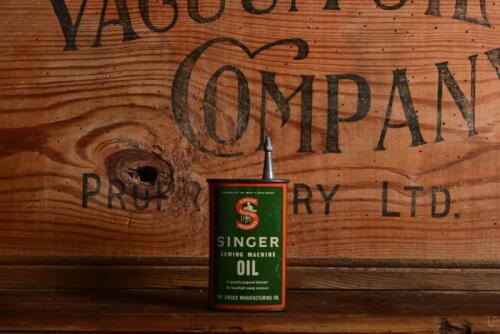 SHELL: A mid 20th century English "Singer Sewing Machine Oil" three fluid ounce tin