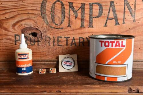 TOTAL: Five Total oil products including a 500 gram grease tin, household oiler, metal pin and two lapel pins