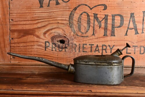 REGA: A circa WWII galvanised steel "Rega" half pint oil can, stamped "Made in Australia, Rega 1/2 Pint" and department of defence "D^D", 30cm long. Note: These were standard equipment with the QF 25 PDR field gun. Used throughout World War 2 and into the