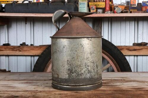 CAN: An early Australian embossed two gallon Rega '043' tin with cap and pourer, 34cm high