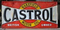 CASTROL: A large 1900/10 enamelled "Castrol Wakefield" sign, with embossed letters and border, overpainted in areas of rust, 89 x 180