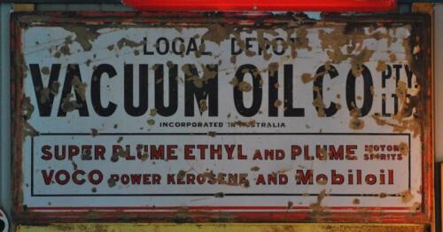 VACUUM: A large enamelled sign "Local Depot Vacuum Oil Co Pty Ltd" with embossed border, 92 x 183cm