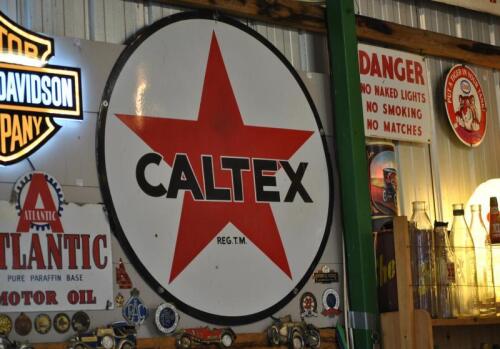 CALTEX: An original circular "Caltex" enamel tin sign, 90cm diameter