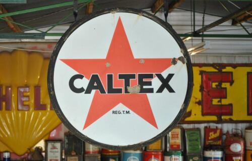 CALTEX: A large double sided circular enamelled "Caltex" sign in original wrought iron hanging frame, 92cm diameter overall