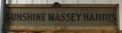 SUNSHINE MASSEY HARRIS: A timber framed Sunshine Massey Harris tin sign, 35 x 154cm overall
