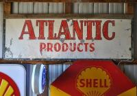 ATLANTIC: A large painted "Atlantic Products" galvanised tin sign, 64 x 175cm