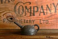 OILER: A rare 19th century cast iron oiler in dome form, 8cm high