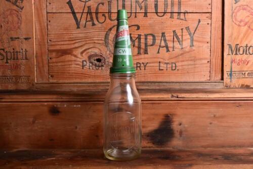 CASTROL: A 1950/60s "Castrol" embossed one quart oil bottle, with circa 1950/60s "Castrol CW" tin pourer and dust cover